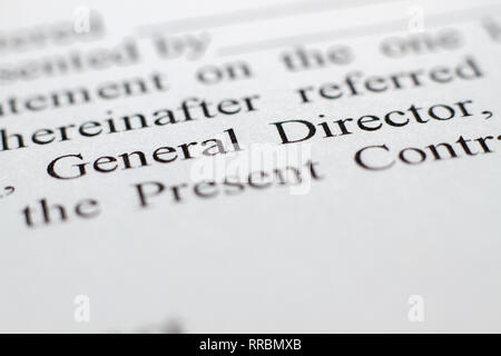 Fragment of a contract printed on paper. Macrophotography The words of the General Director captured close-up. The buyer and the seller made a contrac Stock Photo