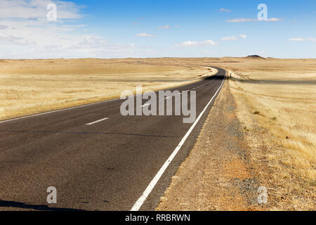 asphalt road Sainshand Zamiin-Uud in Mongolia, beautiful landscape Gobi Desert Stock Photo