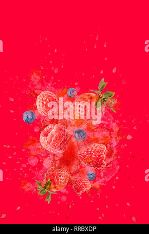 Artfully and lovingly designed photomontage with raspberries, blackberries, strawberries and water splashes in the background Stock Photo