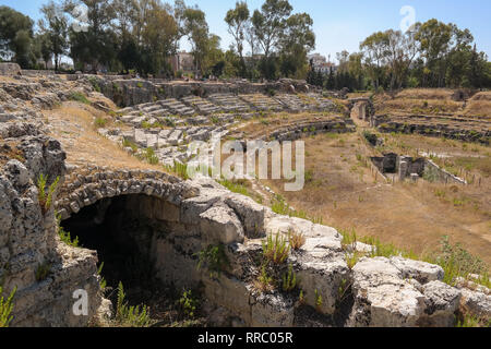 Syracuse Roman Amphitheater or Anfiteatro Romano Siracusa in an archaeological park is one of the best preserved structures from early Imperial period Stock Photo