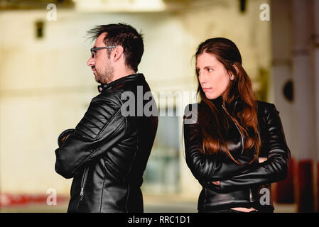 Couple in love angry after an argument, with their backs to each other. Stock Photo