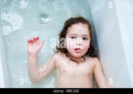 Baby swimming in the bath at home Stock Photo - Alamy