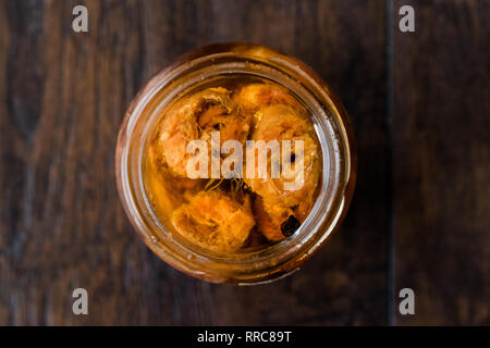 Marinated Canned Anchovy Fillet in Glass Bowl / Instant Anchovies served with Black Pepper. Organic Seafood. Stock Photo