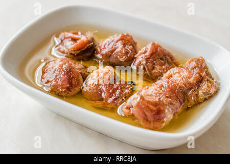 Marinated Canned Anchovy Fillet in Bowl / Anchovies served with Black Pepper on Marble Board. Organic Seafood Stock Photo