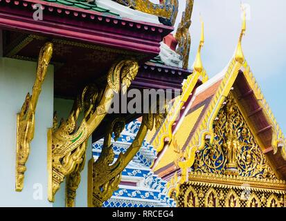 Beautiful Golden Cantilever Roofs and Gable of The Chapel in Wat Phra Kaew Temple and The Grand Palace at Bangkok, Thailand. Stock Photo