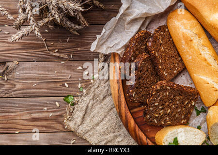Useful bread in wooden bowl Stock Photo