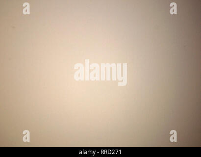 Light brown blurred solid color background. Texture, gradient, vignetting, close-up. Stock Photo