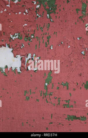 Up close shot of a shed's door that has been painted and repainted over the years. Now the multiple layers of paint are flaking off. Stock Photo