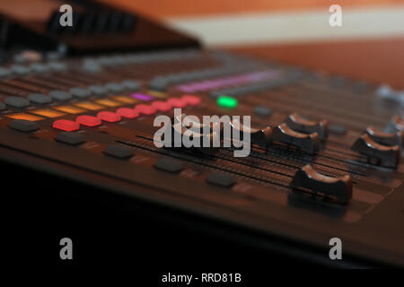 Professional concert mixing console long-stroke faders. Close-up Stock Photo