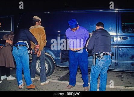 Palmer Park, Maryland, USA, February 11, 1989 Members of the Prince Georges County Police 'Jump Out Squad' handcuff and search suspected crack cocaine dealers before transporting them to the police station Credit: Mark Reinstein / MediaPunch Stock Photo