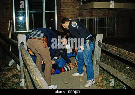 Palmer Park, Maryland, USA, February 11, 1989 Members of the Prince Georges County Police 'Jump Out Squad' arrest suspected crack cocaine dealer. Credit: Mark Reinstein / MediaPunch Stock Photo