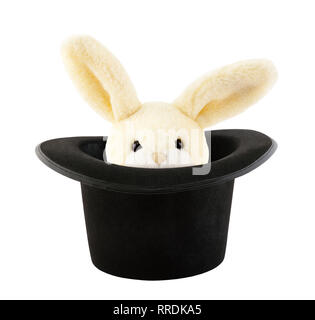 Rabbit toy appearing from a top hat isolated on white background Stock Photo