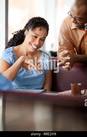 Two Women Meeting For Drinks And Socializing In Bar After Work Stock ...