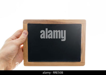 Man hand holding a small blackboard or chalkboard against white background isolated. Stock Photo