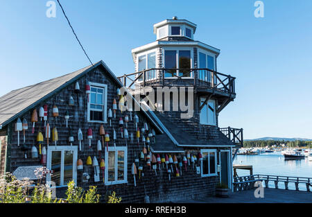 Tremont, Maine, USA - 30 July 2018: lobster buoys are hanging from a house dedicated to Clarence Harding house in Bass Harbor Maine. Stock Photo