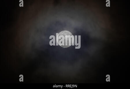 Full moon, with clouds passing over Stock Photo