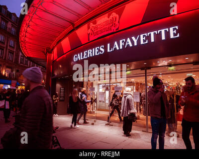 STRASBOURG, FRANCE - DEC 23, 2018: Customers shopping in the winter evening a few days before Christmas in France at galleries Lafayette in central Strasbourg Stock Photo