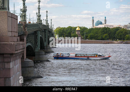 SAINT-PETERSBURG, RUSSIA, MAY 30, 2018: Small excursion ship just sailed under the Troitskiy (Trinity) Bridge on a spring sunny day Stock Photo