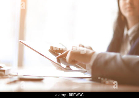 businessman clicks on the screen of a digital tablet Stock Photo