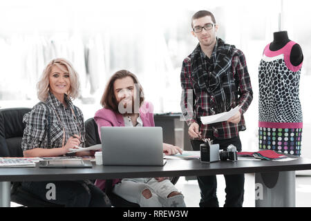 team of designers discussing new ideas in the Studio Stock Photo