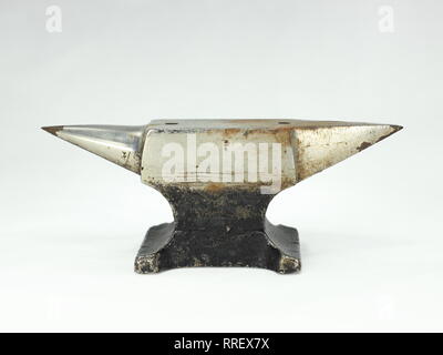 Rusty Grunge Metal Anvil Tool Isolated on white Stock Photo
