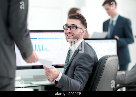 businessman working on a computer on business reports Stock Photo
