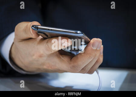 Barcelona, Catalonia, Spain. 25th Feb, 2019. The new blue color model of Xiaomi 9 is seen during the MWC2019.The MWC2019 Mobile World Congress opens its doors to showcase the latest news of the manufacturers of smart phones. The presence of devices prepared to manage 5G communications has been the hallmark of this edition. Credit: Paco Freire/SOPA Images/ZUMA Wire/Alamy Live News Stock Photo