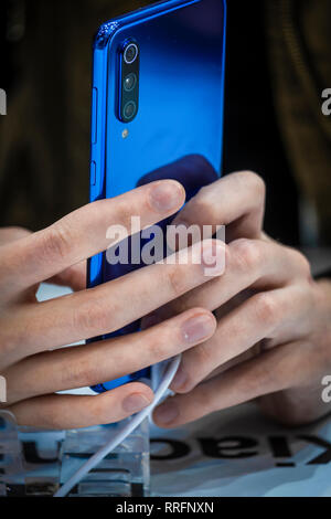 The new blue color model of Xiaomi 9 is seen during the MWC2019. The MWC2019 Mobile World Congress opens its doors to showcase the latest news of the manufacturers of smart phones. The presence of devices prepared to manage 5G communications has been the hallmark of this edition. Stock Photo
