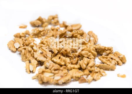 Walnut kernels, close-up macro, isolated on a white background. Walnut kernel texture Stock Photo