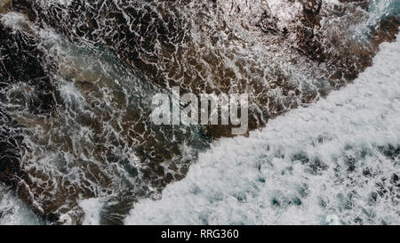 aerial coastline beach waves sea rocks from above Stock Photo