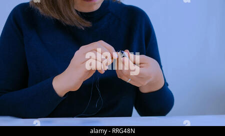 Designer making handmade brooch Stock Photo