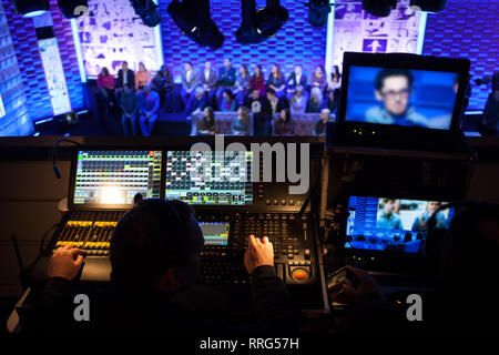 Backstage from the side of the mixing console in the television studio Stock Photo