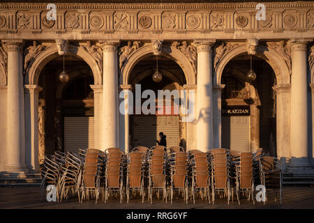 A general view of cafe chairs stacked up on St Mark's Square at sunrise in Venice. From a series of travel photos in Italy. Photo date: Tuesday, Febru Stock Photo