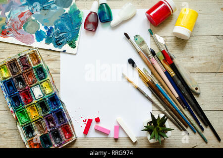 art palette with paint and brushes, close up. Top view with empty space.  workplace for creativity. home teaching concept drawing. 8526923 Stock  Photo at Vecteezy