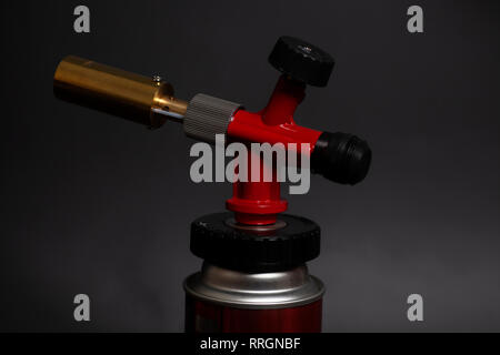 Manual gas burner isolated on black background Stock Photo
