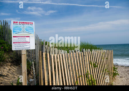 Ditch Plains beach entry Montauk Long Island New York in the Hamptons with rip current warning sign Stock Photo