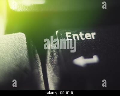 Keyboard Enter in the Dark with Green Light Macro Closeup Stock Photo