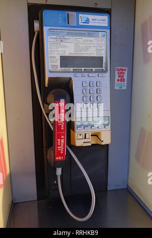 A close up of a pay phone that is still an active line operating on coin money. Stock Photo