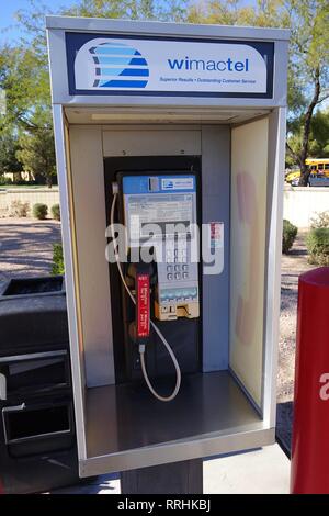 A close up of a pay phone that is still an active line operating on coin money. Stock Photo