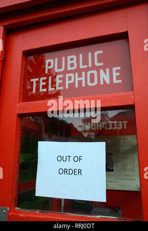 an out of order sign on a public telephone box Stock Photo