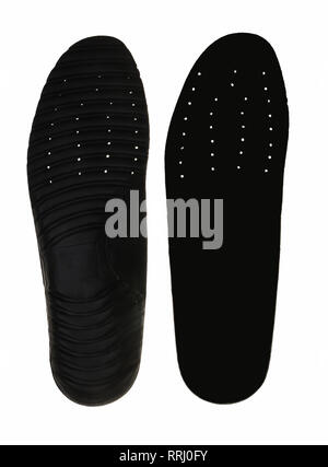 Black insoles for shoes on white background. Stock Photo