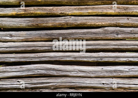 Old weathered log cabin exterior wall background Stock Photo