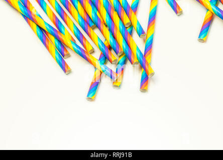 Disposable colorful paper straws on white background Stock Photo