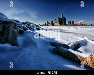 An winter landscape photograph of the Windsor Detroit, Michigan Riverfronts, as seen from the bank of the Detroit River in Windsor, Ontario Stock Photo