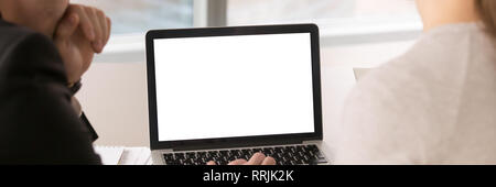 Horizontal image colleagues working on laptop with mockup blank screen Stock Photo