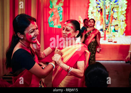 September, 2017,Kolkata,India. Two unidentified ladies playing vermilion sindur khela on the day of dashami. Stock Photo
