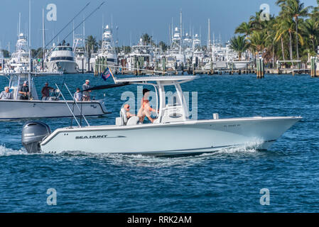 Boating in the Palm Beach Inlet (also known as the Lake Worth Inlet) off of Peanut Island in Palm Beach, Florida. (USA) Stock Photo