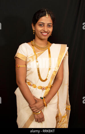 Young girl in traditional Kerala saree and jewelry Stock Photo