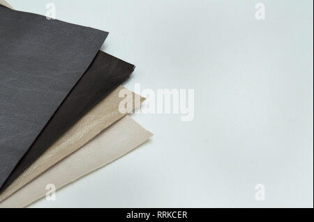 Leather sheet stack of gray color shades on white background. Stock Photo