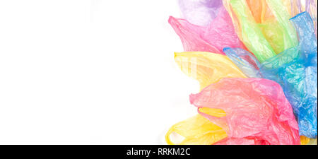 Multicolored single use plastic shopping bags on white banner background Stock Photo